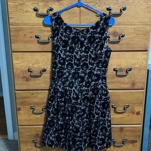 Cream and black cocktail dress.